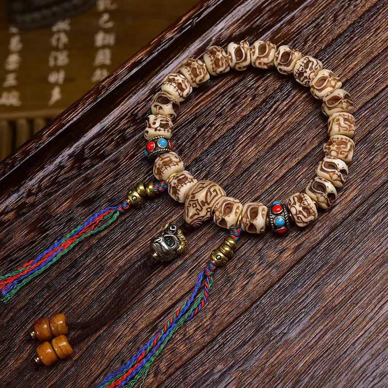 KarmaRipple's Tibetan Camel Bone Garuda Carved Protection Tassel Bracelet p1